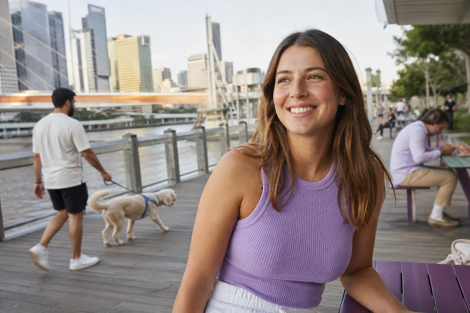 Brisbane single updating an online dating profile beside the river